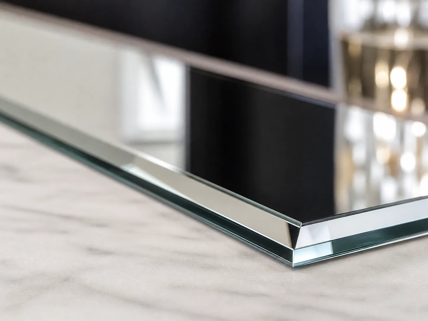 close-up of bevelled glass edge on a mirror